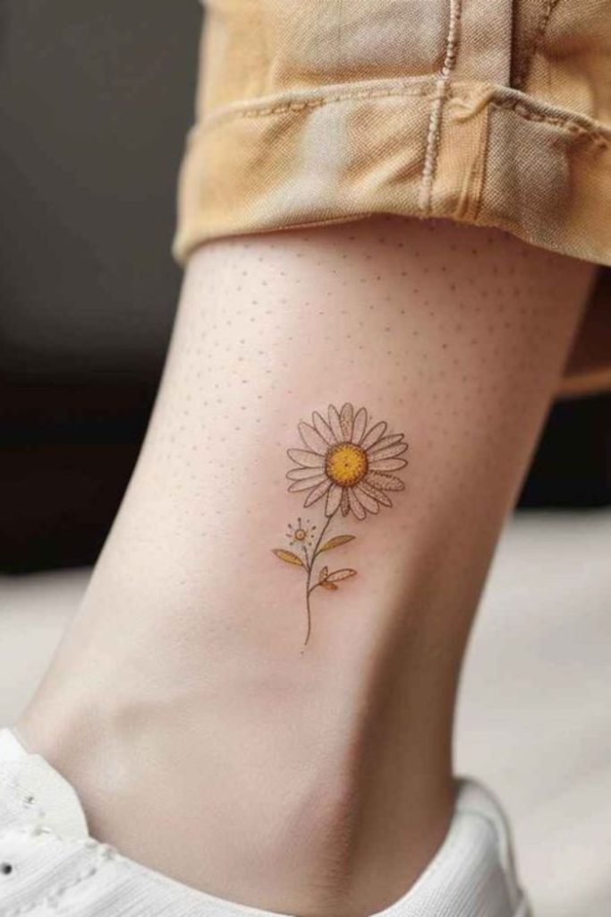 Small daisy flower cheerful tattoo design.