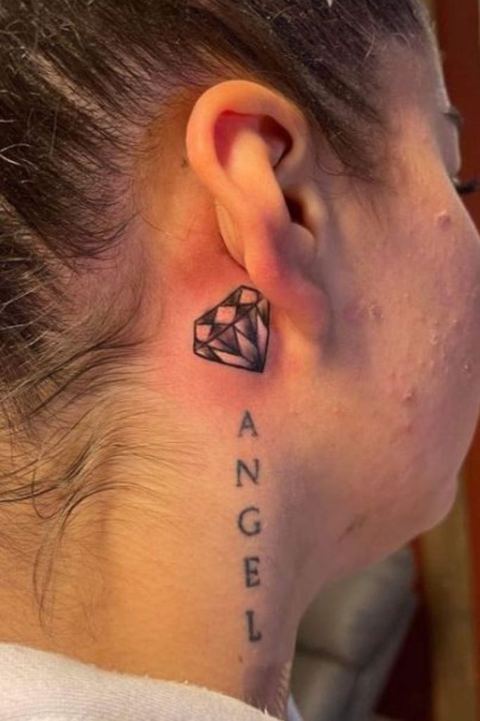 Diamond styled hairline tattoo shimmering accents.