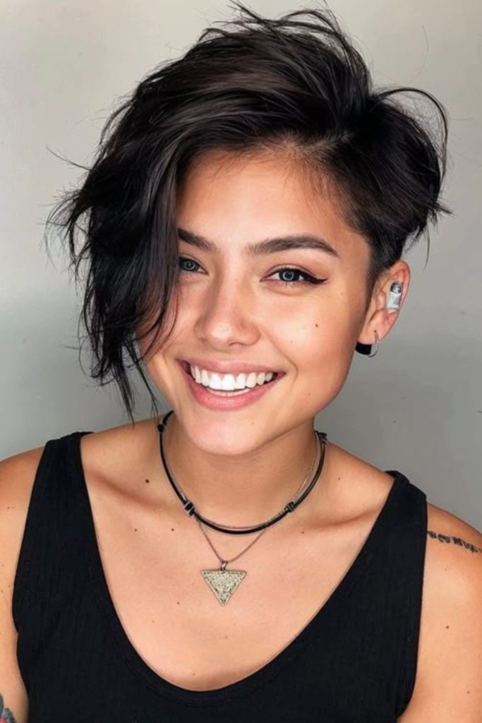 Asymmetrical crop haircut with bold contrast.