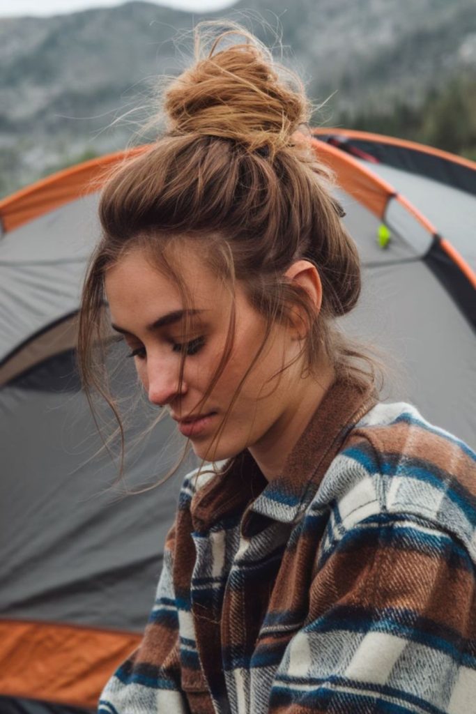Messy bun with rustic camp charm.