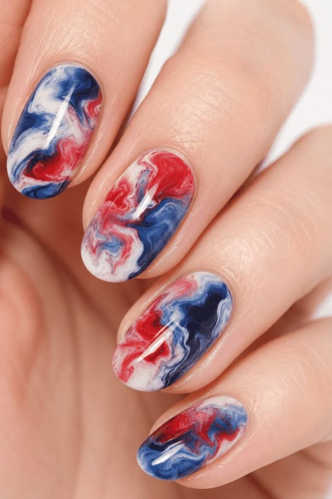 Patriotic ombre sky gradient nails.
