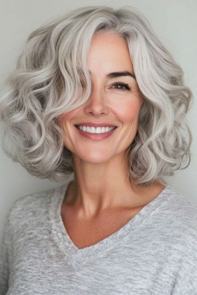 Frosted gray curly bob hairstyle.