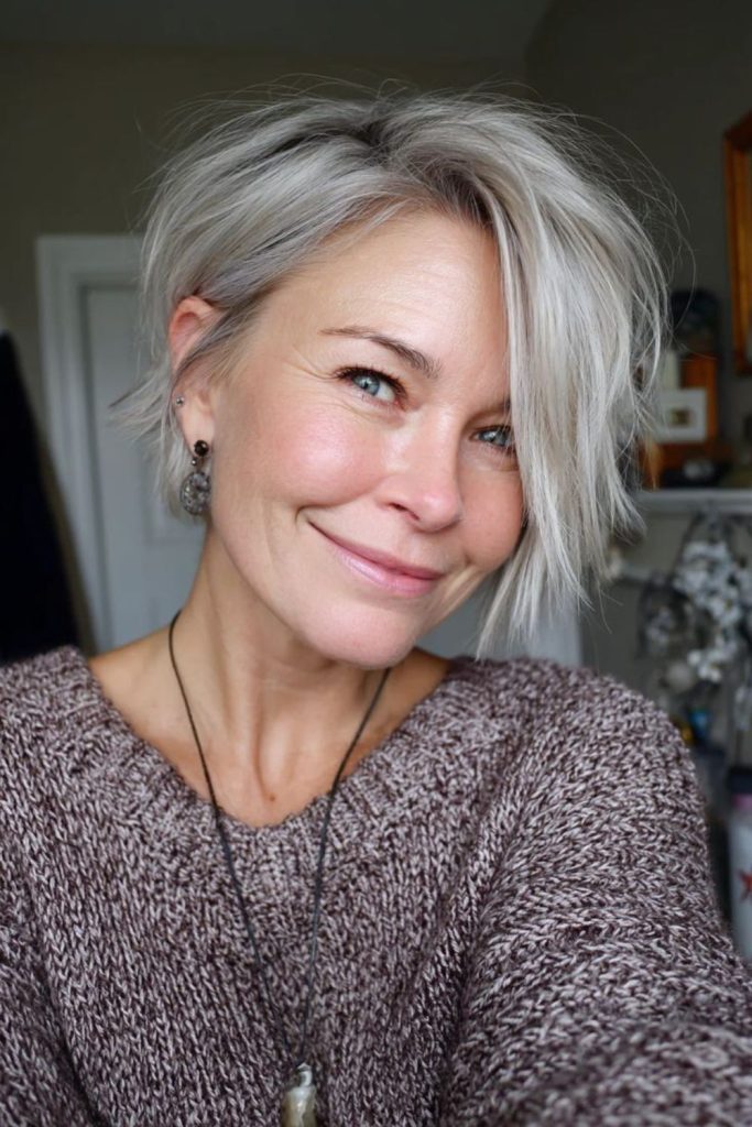 Gentle swoop ash blonde bob smooth framing style