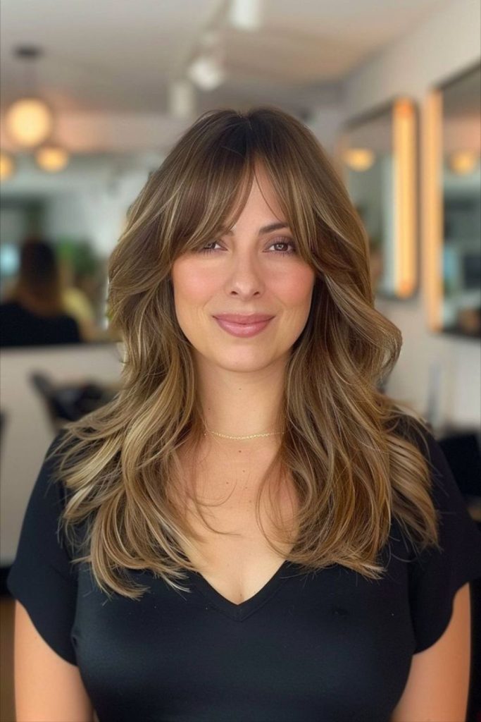 Honey toned feather layers gentle bangs
