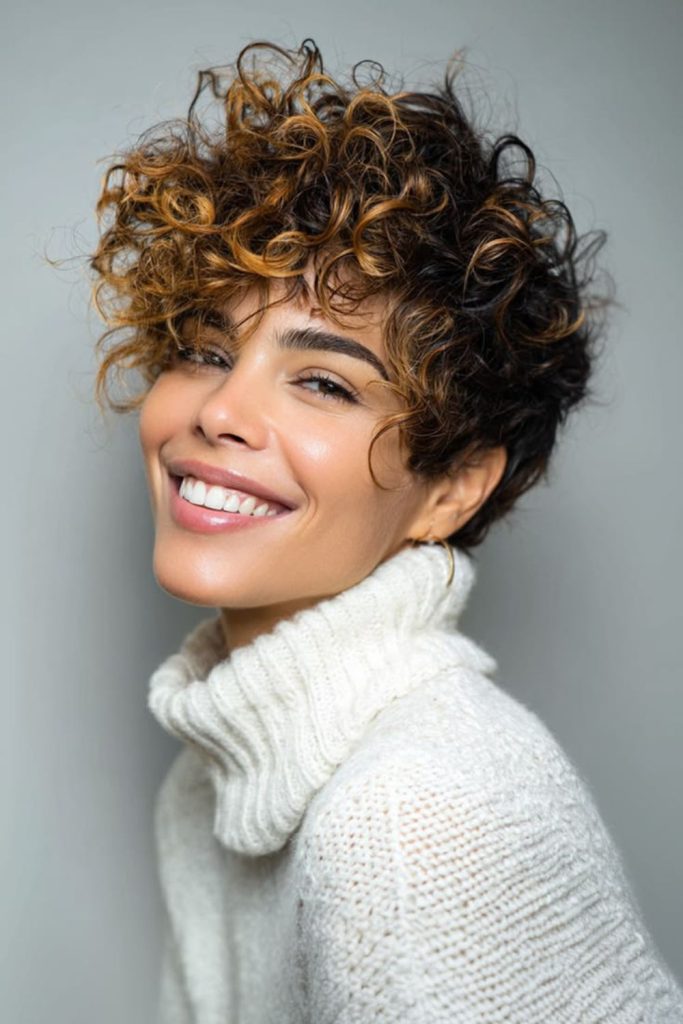 Modern crop hairstyle with layered texture.