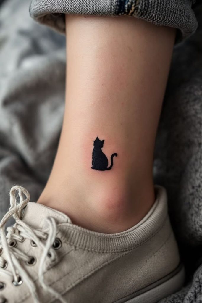 Minimal cat silhouette cute tattoo design.