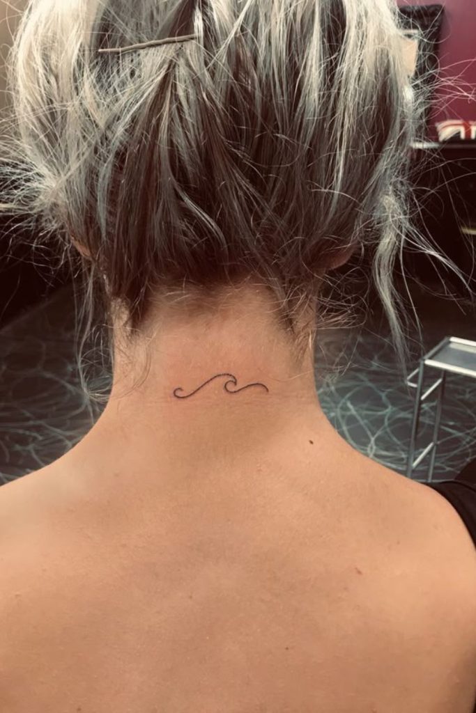 Wave pattern hairline tattoo ocean flow.