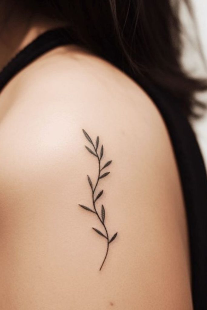 Delicate olive branch elegant tattoo design.