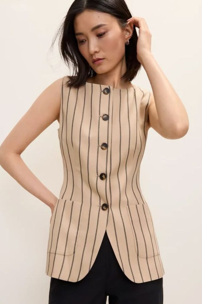 Striped outfit with sleeveless blazer elegance