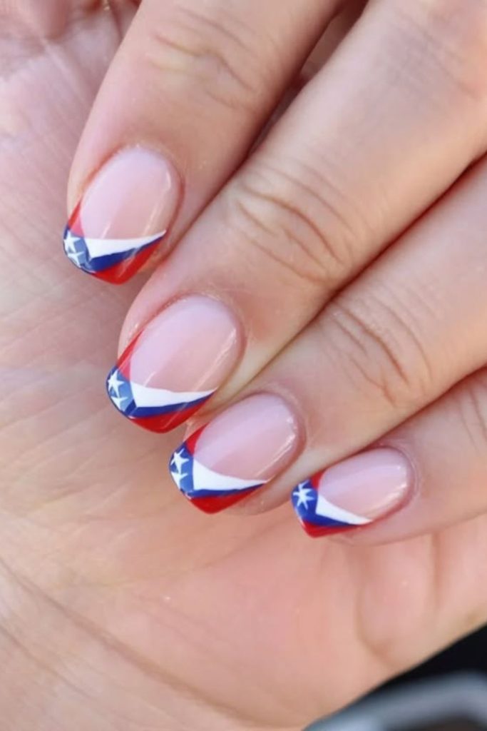 Patriotic French tip nail design.