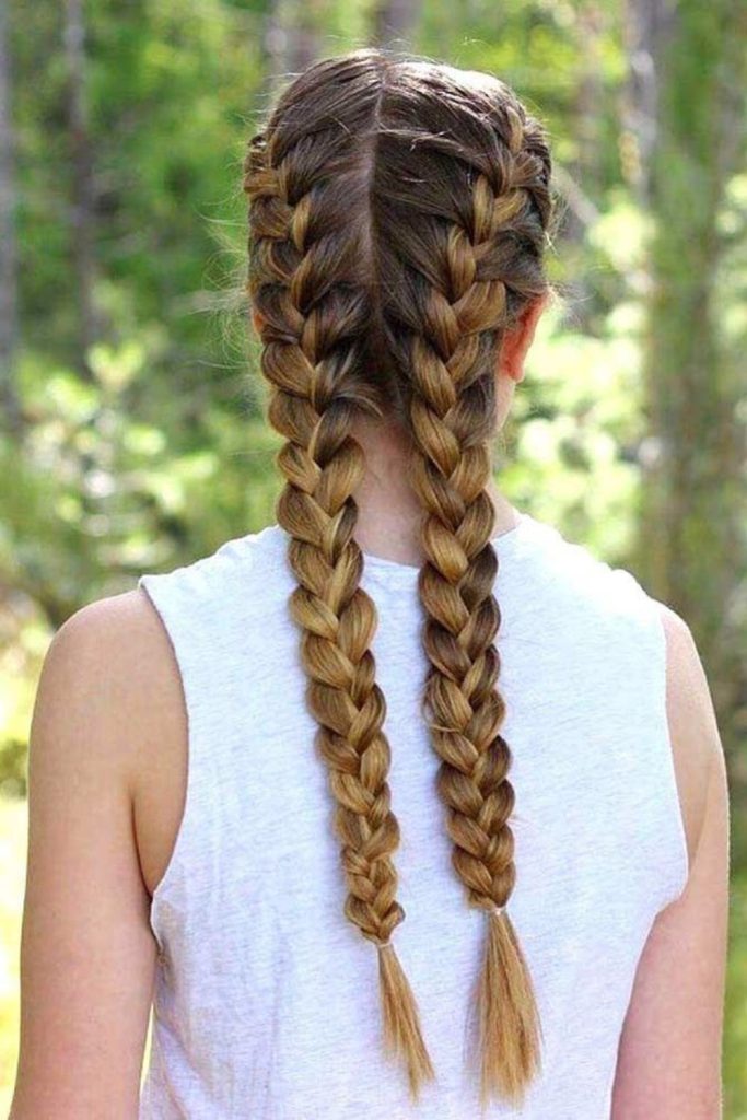 Braided pigtails for outdoor camping fun.