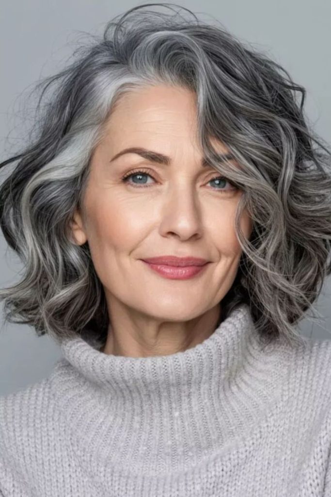 Platinum wave side swept gray curls elegant flow