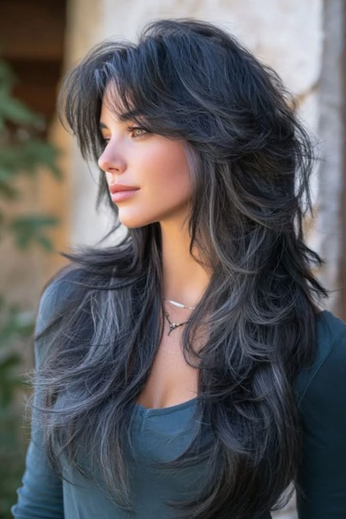 Raven black layers and wispy fringe.