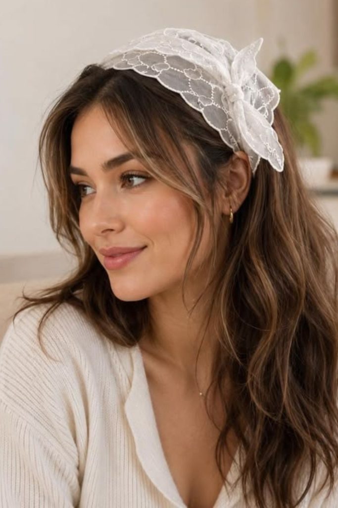 Ribbon headband with softly swept hairstyle.