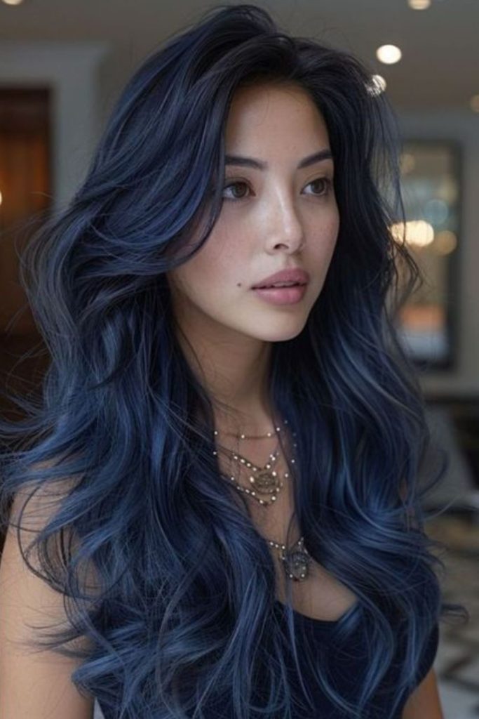 Sapphire toned layers with full bangs.