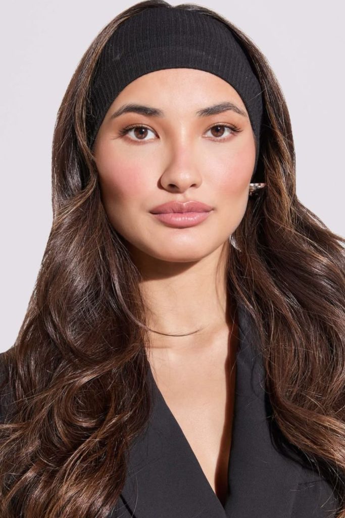 Layered crown hairstyle with thick headband.