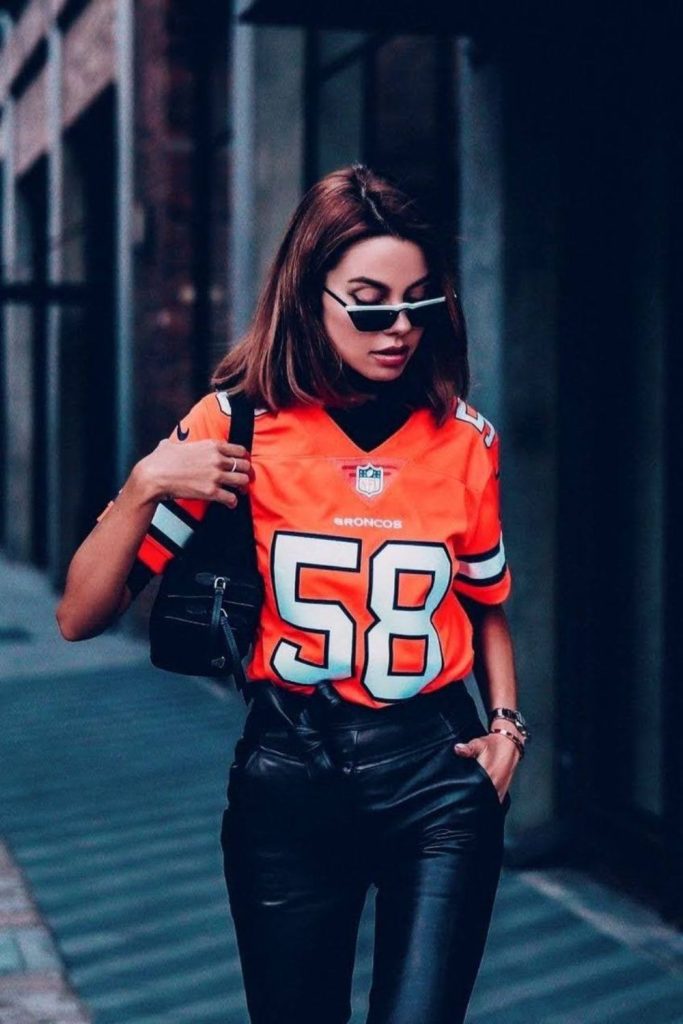 Graphic football jersey leather leggings look