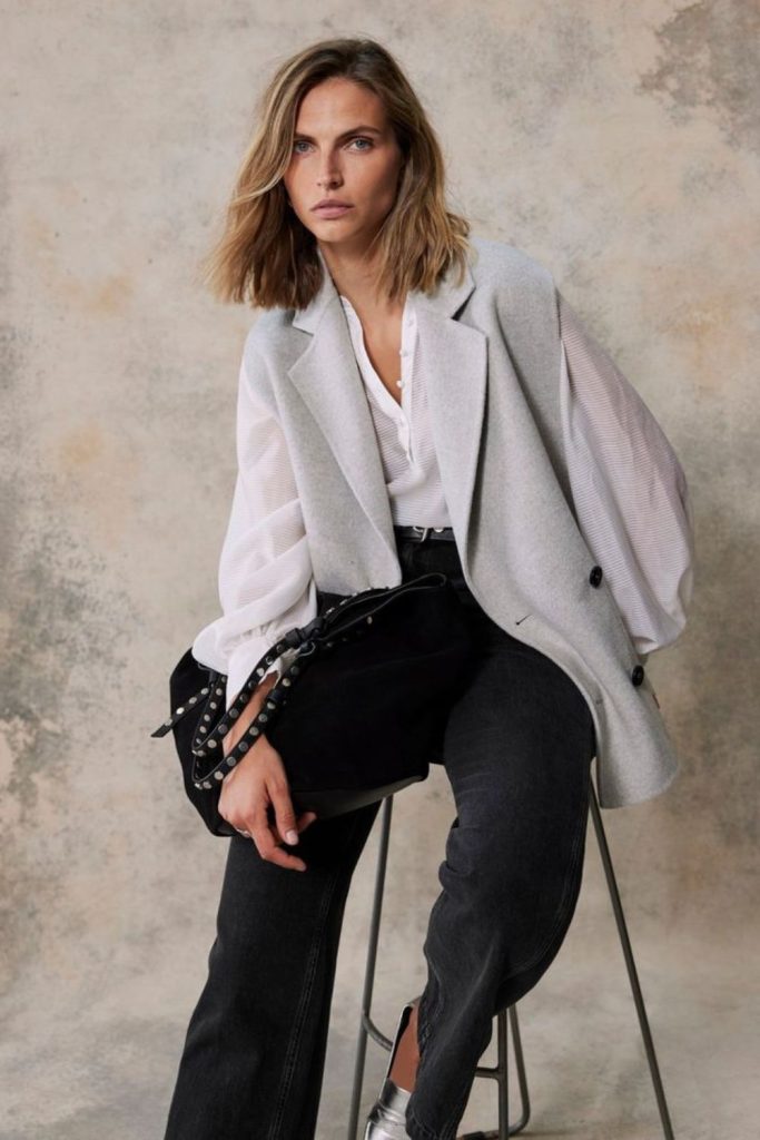 Sleeveless blazer with silver accessories style