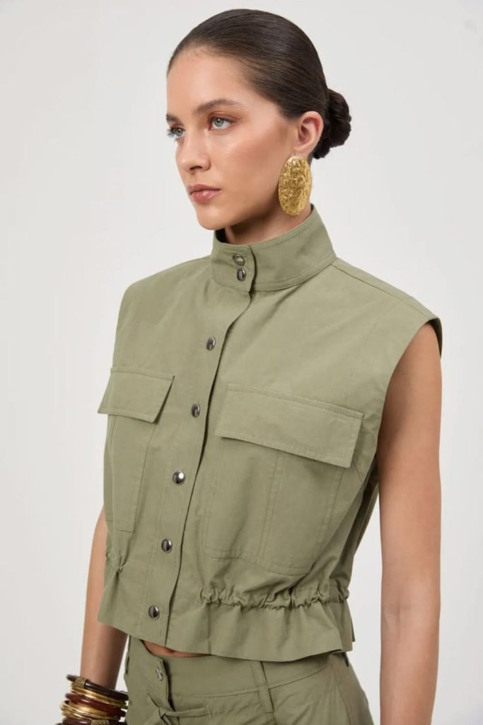 Sleeveless blazer paired with cargo pants