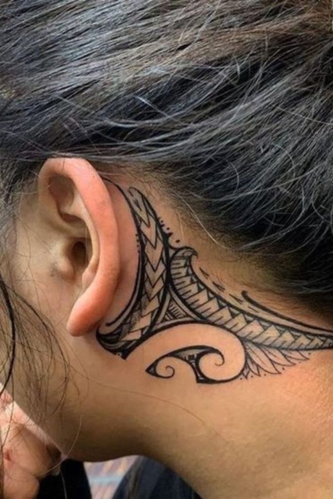 Tribal hairline tattoo bold flowing lines.