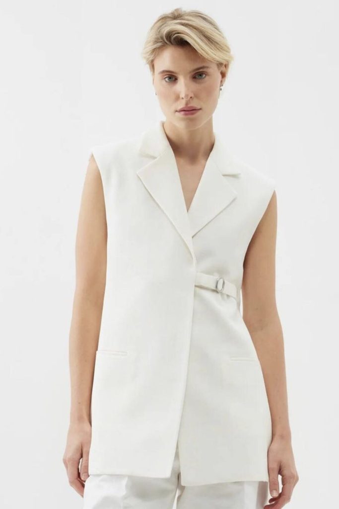 White denim and sleeveless blazer outfit