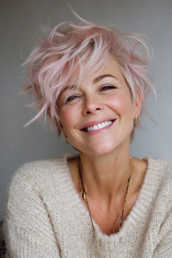 Asymmetrical pixie haircut with side sweep.