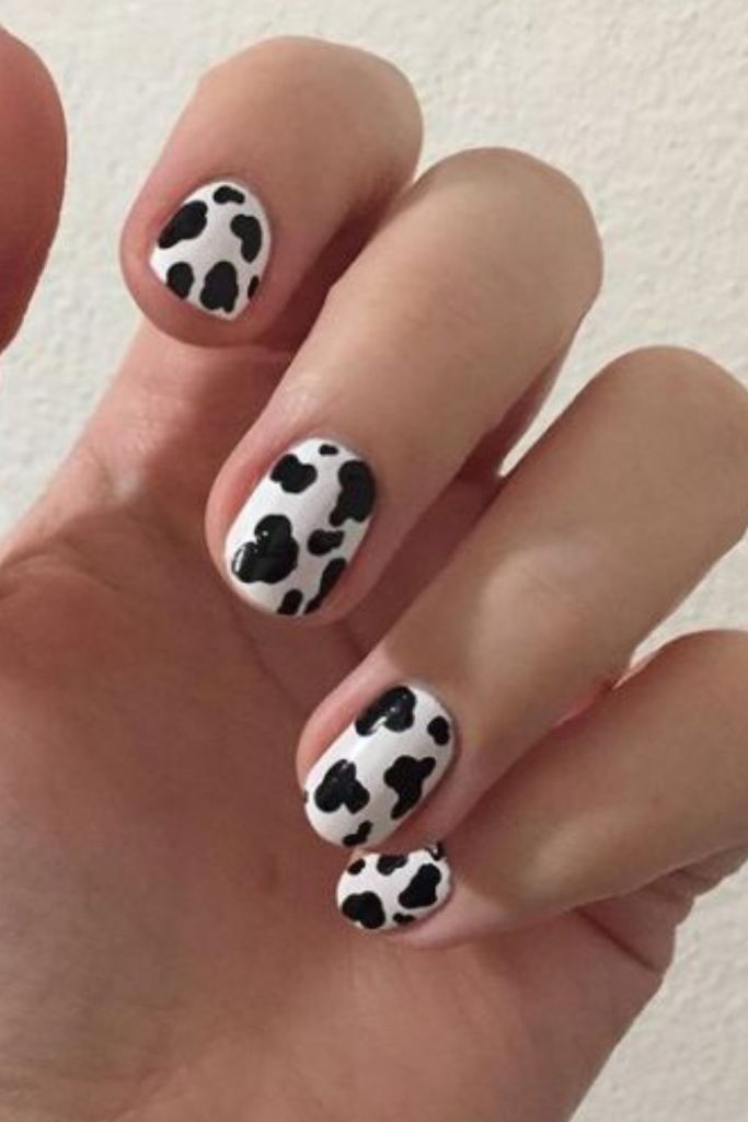 Black cow print baddie nails