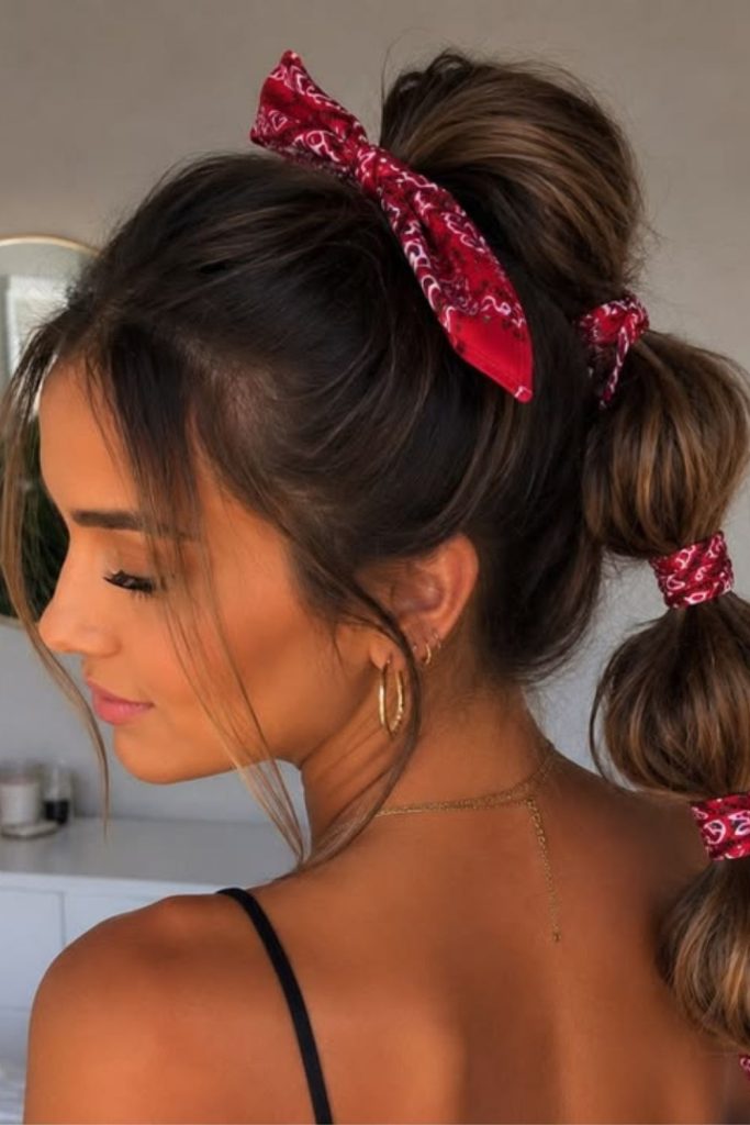 Bubble ponytail wrapped with colorful bandana.