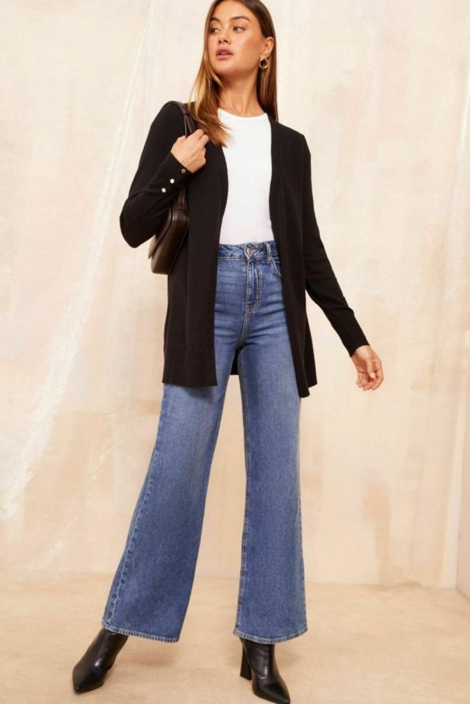Black cardigan with faded jeans