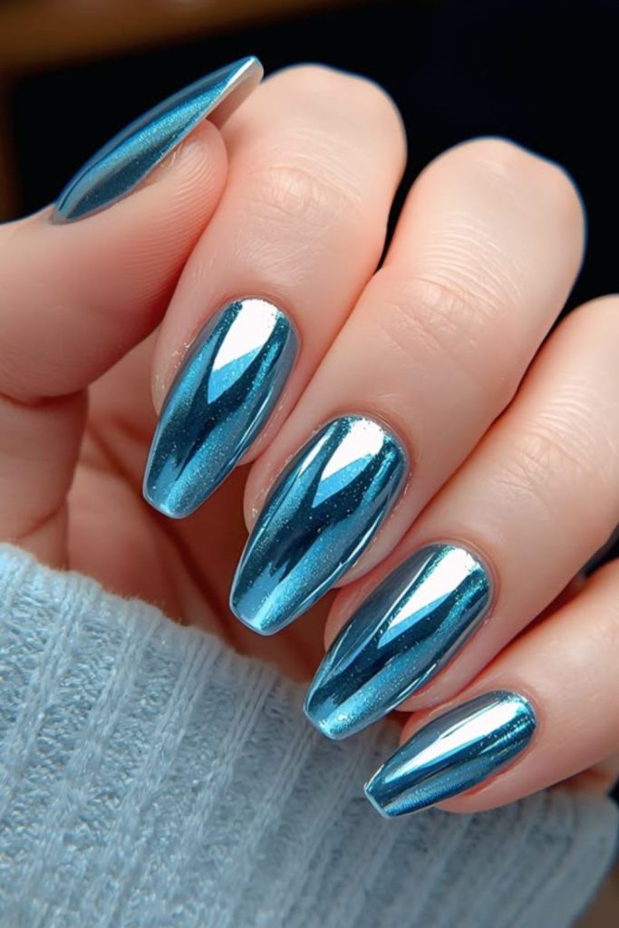 Aqua chrome tropical nail design.