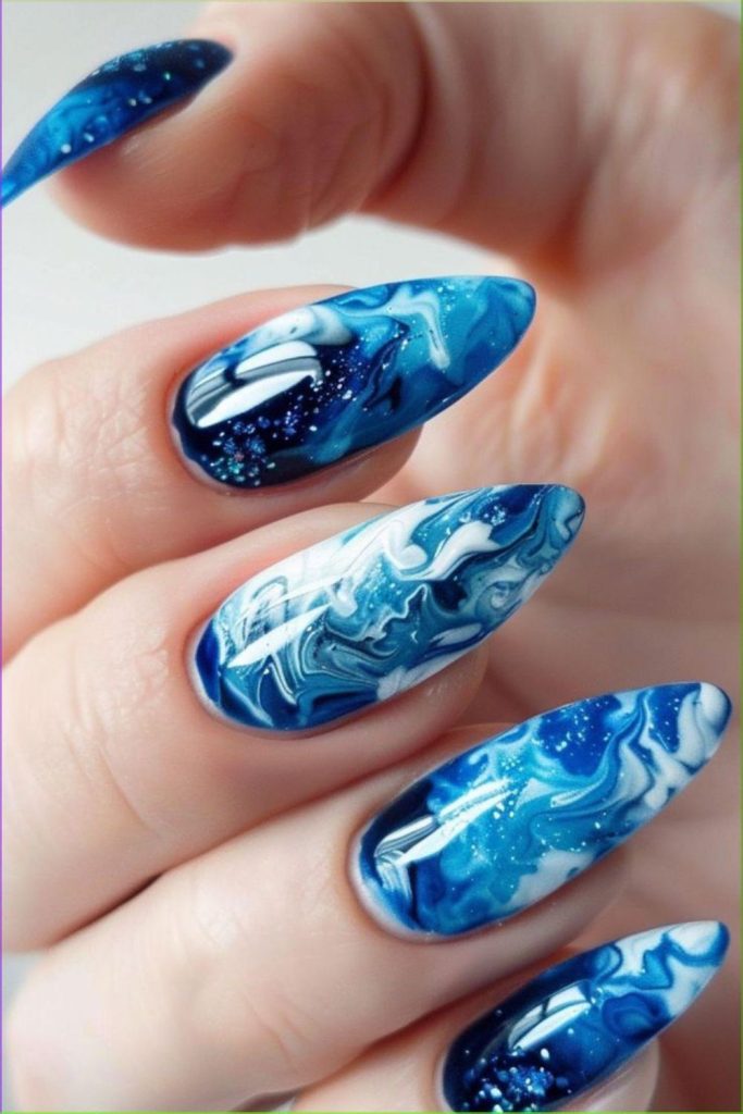 Blue marble lagoon inspired nail art.