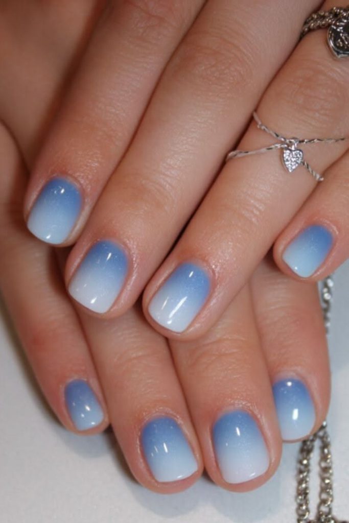 Blue ombre gradient elegant nail design.