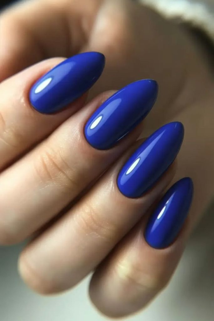 Blueberry glazed glossy oval nails.
