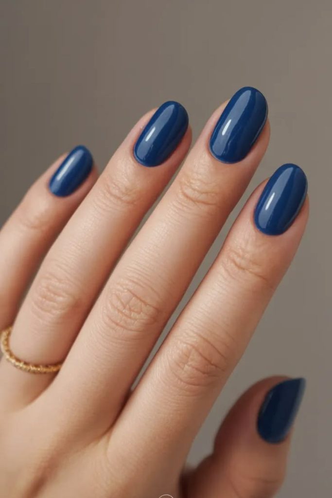 Blueberry glazed glossy blue nails.