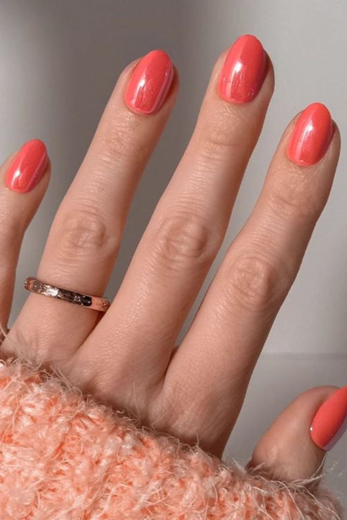 Coral glow summer nail design.
