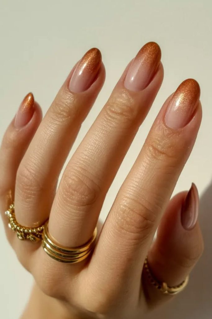 Bronze flame metallic nail design.
