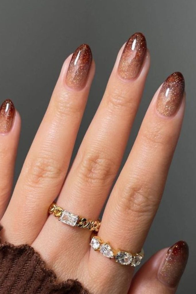 Bronze sunset ombre manicure design.