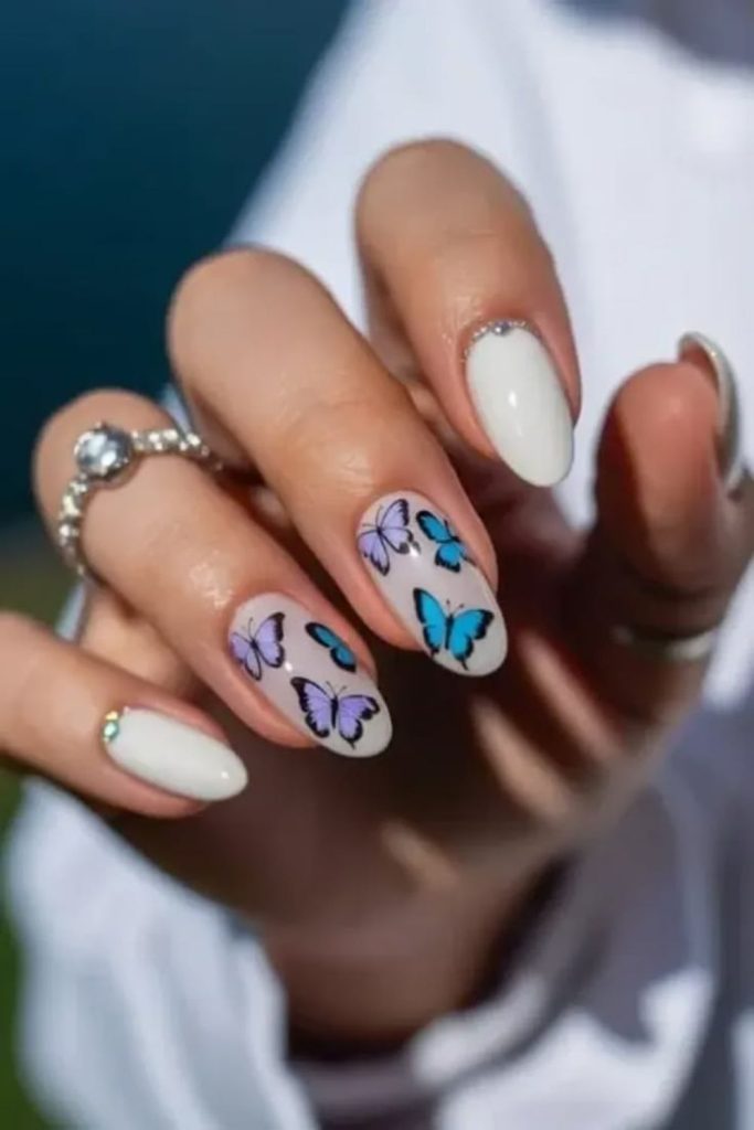 Butterfly art nude pink nails.