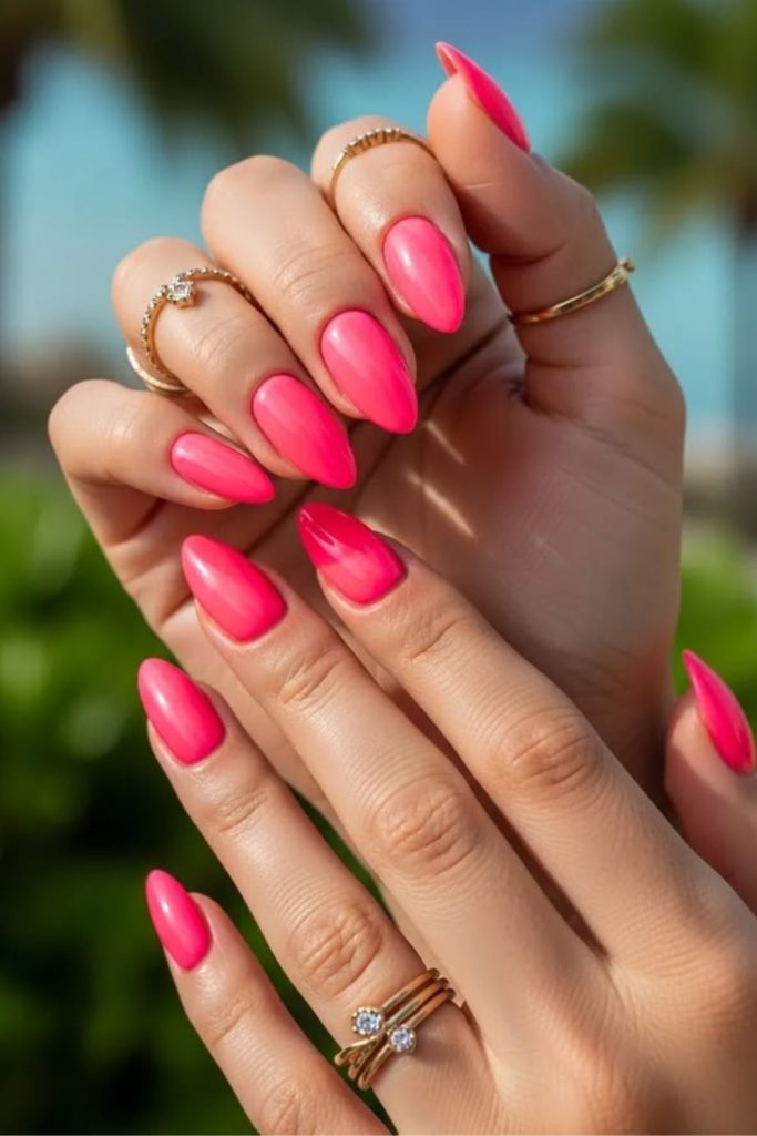 Neon peach vibrant summer nail style.