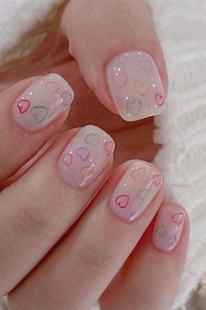 Pastel heart accent teen nails.