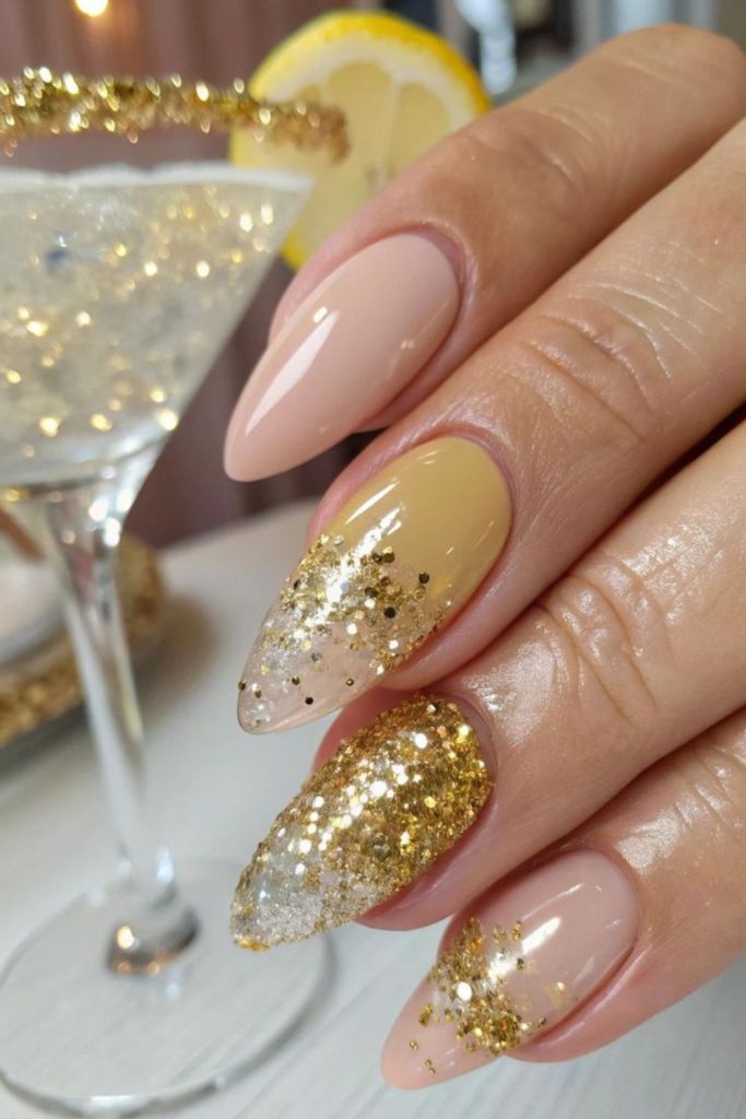 Champagne confetti glitter nude manicure.
