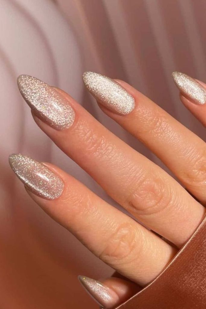 Champagne glitter nails with golden French.