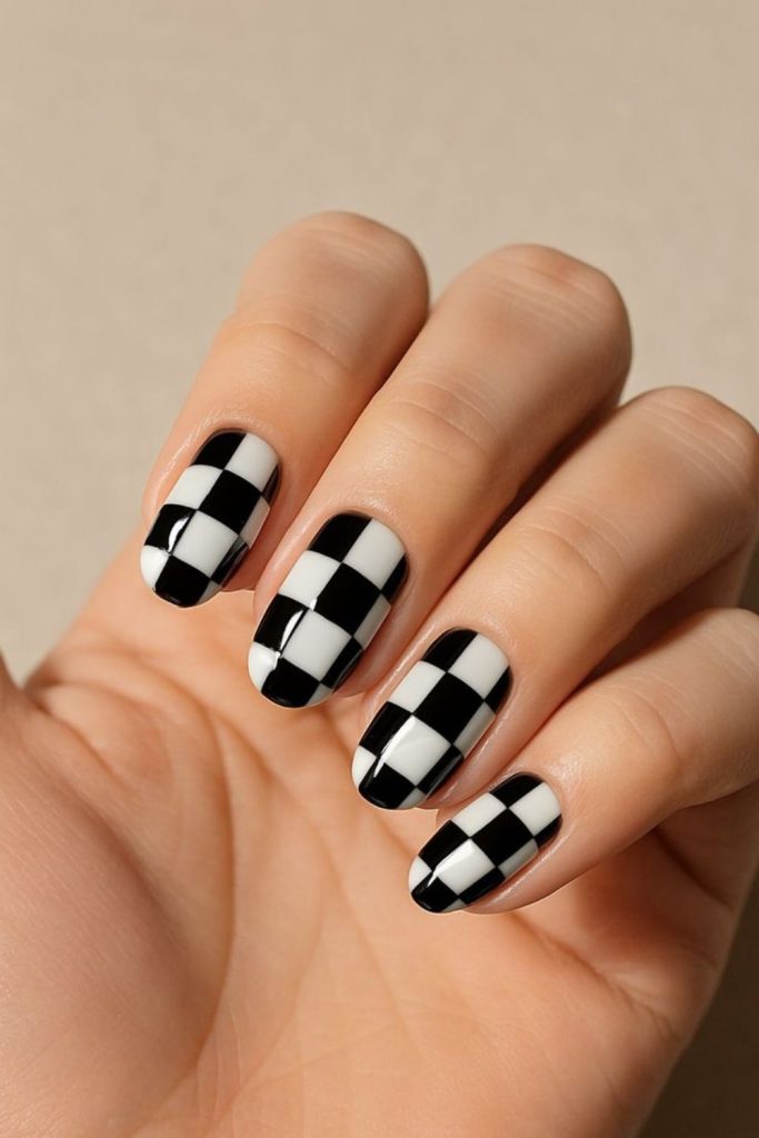 Black white checkerboard nail design.