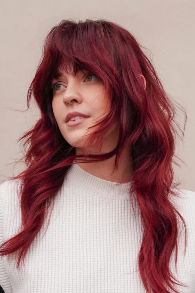 Cherry cola wolf cut with bangs.