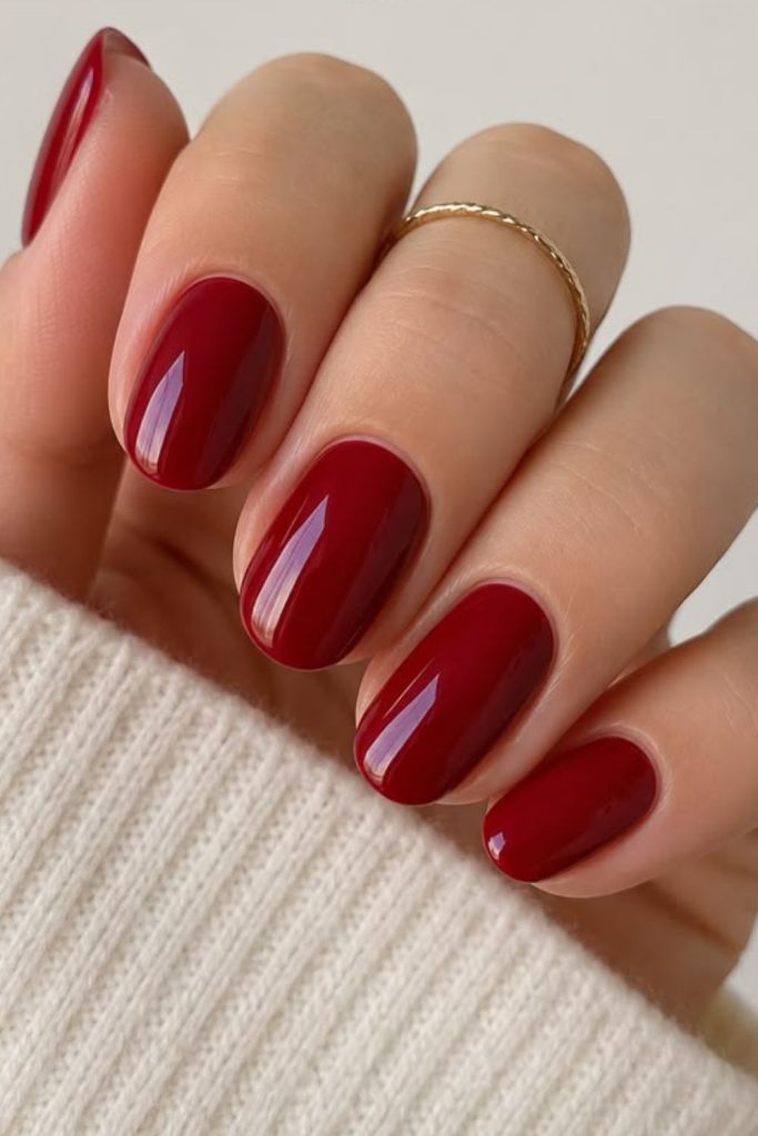 Glossy cherry red teen school nails.