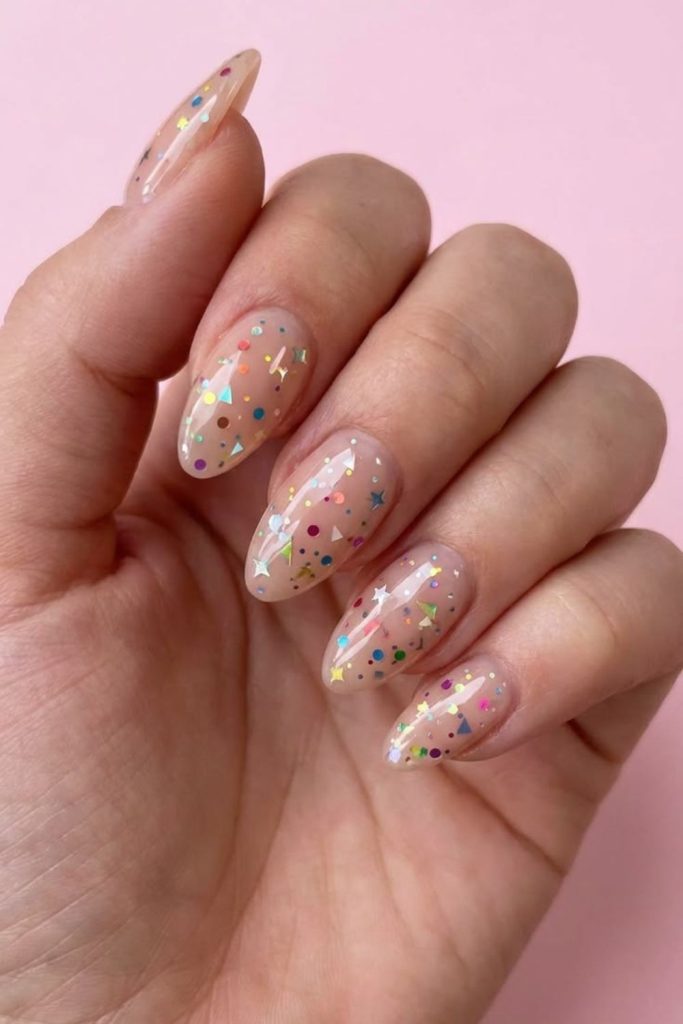 Colorful classroom confetti nail design.