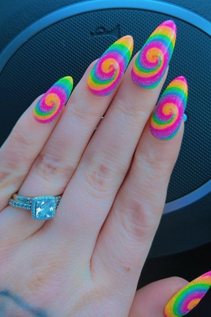 Vibrant rainbow color wheel nails.