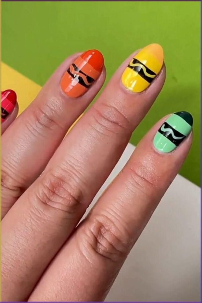 Colorful marker doodle nail design.