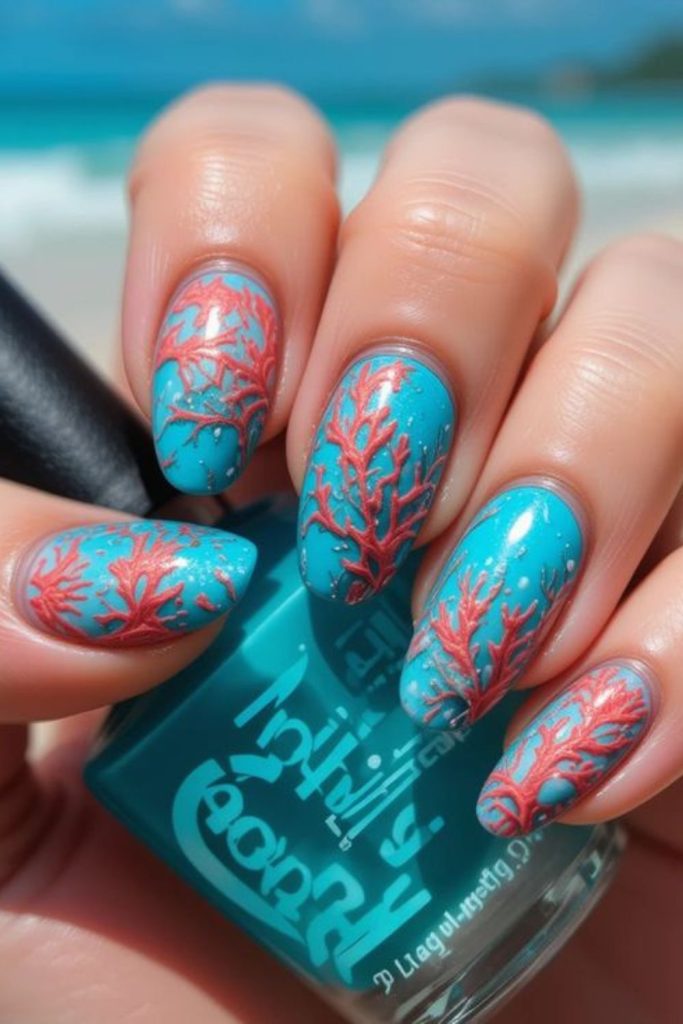 Coral reef artistic summer nail design.