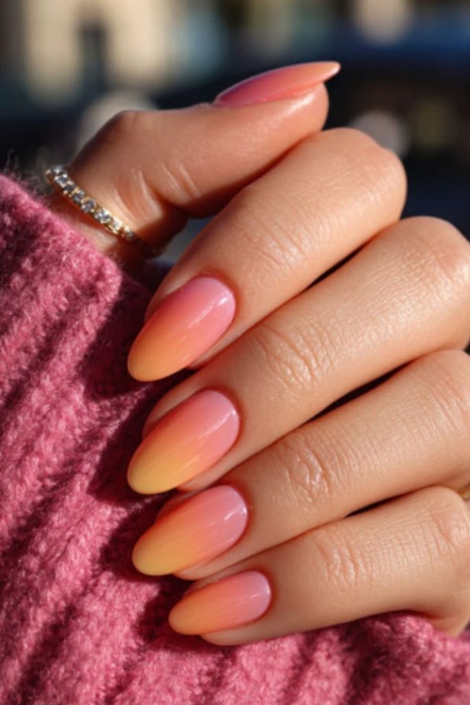 Coral ombré sunset nail design.